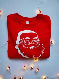 **Sweatshirt only** Check for sizing details in pictures! Vintage Santa Crewneck Sweatshirt, Red Kids Sweatshirt, Christmas Shirt, Toddler Christmas Outfit, Kids Christmas Outfit, Christmas Party 2T-size 7 is Rabbit Skins brand and is 60/40 cotton/polyester Youth Small-Youth Large is Gildan Brand and is 50/50 preshrunk cotton/polyester Thank you for shopping small, it means so much to us! -Emily and Chad Christmas Outfit Kids, Outfit Christmas Party, Toddler Christmas Outfit, Red Images, Kids Christmas Outfits, Santa Sweatshirt, Outfit Christmas, Toddler Christmas, Vintage Santa