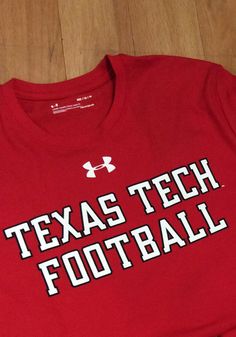 Under Armour Texas Tech Red Raiders Red Mahomes Short Sleeve T Shirt Red Cotton Tops For Team Spirit, Sporty Red Tops For Team Events, Red Tops With Team Spirit For Football Season, Red Tops With Team Name For Football Season, Red Team Name Tops For Team Events, Red Tops With Team Logo For Fans, Red Tops For Football Season With Team Spirit Style, Red T-shirt For Team Events, Red Tops For Football Season Sports Events