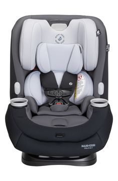 the child's car seat has two cups in it