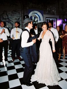 a bride and groom dancing on the dance floor