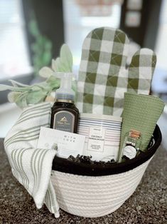 a basket filled with personal care items sitting on top of a counter next to a pair of oven mitts