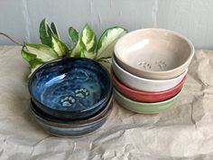 four bowls are stacked on top of each other