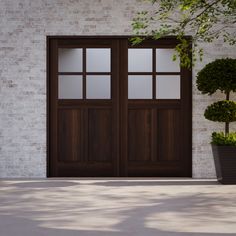 two brown double doors in front of a white brick wall and potted planter