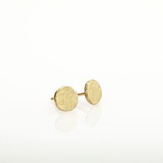 "Gold earrings, round simple and perfect for every day's wear. These organic stud earrings are hand fabricated from yellow 14k solid gold. I melted the gold and then hammered it to its irregular shape. No two are ever identical; each has a unique and organic look. The edges of the pebbles are rough, while the flat surface has a delicately scratched brushed finish. These are classic, minimalist, \"wear with everything\" gold earrings - a perfect gift, or a treat for yourself. Earrings diameter is Classic Hammered Earrings For Everyday, Classic Round Earrings In Recycled Gold, Classic Round Recycled Gold Earrings, Hypoallergenic Round Earrings In Recycled Gold, Hand Forged 14k Gold Minimalist Earrings, Round Recycled Gold Earrings As Gift, Everyday Hammered Yellow Gold Earrings, 14k Gold Round Everyday Earrings, Everyday Yellow Gold Hammered Earrings