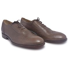 Brogue oxford style leather shoes are the iconic choice for business and casual wear as they go best with all sorts of clothing from jackets to blazers to sports coats, trousers, and even chinos. This pair of brogue leather shoes is the perfect combination of chic and sophisticated. Manufactured using high-quality genuine leather, these oxford shoes are never going to disappoint you in terms of both fashion and comfort. Lined with inner padding to make the shoes a comfortable fit for anyone who wears them, they are topped off with a sleek embroidered design in the center. Nothing over the top, yet displaying smartness and elegance, these leather beauties are a must have in your shoe rack. Product features include: Use of high-quality leather A soft insole with leather padding The attractiv Leather Top Hat, Purple Leather Jacket, Brown Brogues, Leather Formal Shoes, Oxford Brogues, Oxford Style, Brown Oxfords, Suede Leather Shoes, Genuine Leather Boots