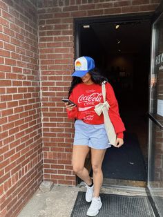 Cutest casual vibe for the weekend | Coca Cola Crewneck from The Laundry Room with striped boxer shorts and comfy sneakers! Coca Cola Outfit, Coke Logo, Comfy Sneakers, Rainy Day Outfit, Airport Outfit, Casual Dinner Outfit, Boxer Shorts, Red Fabric, School Outfit