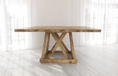 a wooden table sitting on top of a white floor