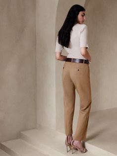 A tailored piece of performance, this soft and luxurious pant is crafted from responsible Italian wool that moves with ease.  A sleek and modern fit for the office or date night.  Stretch, Breathable, Wrinkle-Resistant.  Mid-rise.  Slim leg.  Ankle length.  Fabric from Italy's Marzotto Mill.  Zip fly with button closure.  Four-pocket styling.  Flat front.  Trouser crease.  Unlined.  Slim-Straight Fit: Mid-rise (8").  Straight throughthe hip and thigh, slim leg opening.  Ankle length.  Inseams: P Tailored Wide-leg Chinos For Workwear, Tailored Chinos For Workwear, Fall Season, Tailored Wide Leg Chinos For Work, Tailored Chinos For Fall Workwear, Classic Tapered Leg Chinos For Work, Chic Stretch Chinos For Business Casual, Elegant Relaxed Fit Chinos With Straight Hem, Welt Pockets Ankle-length Chinos For Work, Versatile Straight Leg Business Casual Dress Pants