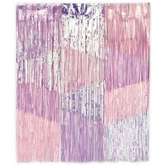 a pink and purple wall hanging on the side of a building with lots of fringes