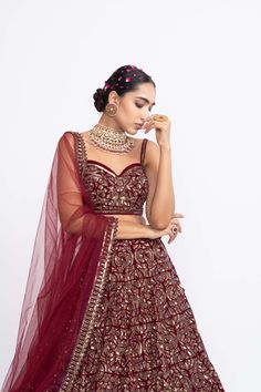 Editor's Note Mehroon Corset Blouse Paired With Dense Dot Lehenga Set Fabric: Velvet, Net Color: Maroon Care: Dry Clean Only About the Designer Vvani by Vani Vats- an Indian ethnic women’s wear label. It is a depiction of the royal and intricate handcrafted embroideries in unconventional designs. Corset Lehenga, Maroon Bridal Lehenga, Velvet Dupatta, Embroidered Corset, Blouse Yoke, Net Blouse, Lehenga Dupatta, Corset Blouse, Net Blouses