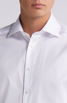 Cut in a slim fit, this sharp dress shirt is constructed from high-performance, crease-resistant cotton and fitted with a classic spread collar. 32" length; 45" chest (size 16.5) French placket Spread collar Mitered, adjustable button cuffs Darts at the back to adjust the width Curved hem 100% cotton Dry clean or machine wash, line dry Imported Formal Slim Fit Wrinkle-resistant Shirt, Fitted Cotton Shirt With Wrinkle-resistant Finish, Fitted Cotton Shirt With Wrinkle-resistant Feature, Fitted Wrinkle-resistant Cotton Shirt, Wrinkle-resistant Fitted Cotton Shirt, Classic Slim Fit Wrinkle-resistant Tops, Elegant Business Tops Wrinkle-resistant, Elegant Business Top With Wrinkle-resistant Fabric, Elegant Wrinkle-resistant Business Top