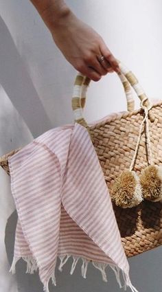 Our St Tropez tote is made of natural seagrass and features matching raffia poms poms. Roomy enough for your beach towel, sunglasses and more. Measurements: 17.5" W x 9.5" H x 5.5" D FINAL SALE Chic Straw Beach Bag With Tassels, Chic Beach Straw Bag With Tassels, Trendy Beach Straw Bag With Tassels, Trendy Beach Bag With Tassels, Chic Tassel Straw Beach Bag, Chic Pink Beach Bag For Beach Season, Trendy Tassel Beach Bag, Chic Pink Beach Bag For Summer, Chic Straw Bag With Tassels