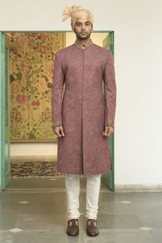 Blush pink sherwani with all over woven paisley patterns and sequin embellishments. Comes with inner kurta and churidar. - Aza Fashions Formal Pink Kurta With Naqshi Detailing, Pink Traditional Naqshi Sherwani, Designer Pink Sherwani With Pallu Detail, Designer Pink Sherwani With Pallu, Designer Pink Sherwani Straight Kurta, Designer Pink Semi-stitched Sherwani, Pink Festive Bandhgala For Ceremonial Occasions, Festive Pink Ceremonial Bandhgala, Festive Pink Bandhgala For Ceremonial Occasions