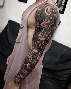 a man with a tattoo on his arm