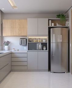 a modern kitchen with stainless steel appliances and cabinets