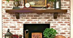 a brick fireplace with potted plants and other items on the mantel above it