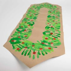 a piece of paper that has been made to look like a handprinted christmas tree