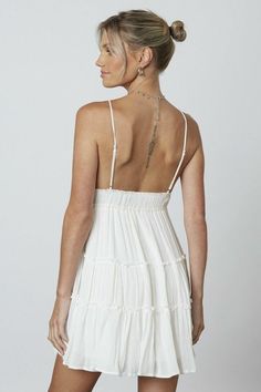 STYLE INFORMATION: Summer days are special in the Brynn White Tiered Mini Dress! Lightweight woven fabric shapes adjustable spaghetti straps that fall into a V-neckline bodice, continuing into an open back. Empire waist tops an A-line skirt that falls to a tiered mini hem. DETAILS & CARE: Rayon. Machine wash cold. Imported. SHIPPING: Orders are processed within 1-2 business days. Packages are shipped out Monday-Friday, holidays are excluded. Chic Sundress With Ruffled Straps, White Strappy Sundress With Adjustable Straps, Lined Mini Dress With Spaghetti Straps For Daywear, Chic Strappy Dress With Smocked Back, Lined Sundress With Spaghetti Straps, Flowy Mini Dress With Adjustable Straps, Chic Mini Dress With Smocked Bodice And Spaghetti Straps, White Sundress With Smocked Bodice And Spaghetti Straps, Chic White Sundress With Delicate Straps