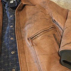 Full Grain Leather With Beautiful Inner Lining. Outside You Have 2 Zippered Along With 2 Additional Hand Warmer Pockets. Inside Are Also One Buttoned As Well As Another Zipper Pocket. All In Perfect Condition. Blue Shirt Not Included. Vintage Brown Rugged Outerwear With Pockets, Rugged Brown Outerwear With Flap Pockets, Rugged Distressed Brown Outerwear For Fall, Rugged Distressed Brown Outerwear For Outdoor, Rugged Brown Outerwear For Work, Vintage Distressed Brown Outerwear With Pockets, Rugged Brown Collared Outerwear, Brown Outerwear With Welt Pockets For Outdoor, Casual Brown Leather Jacket With Double-needle Stitching