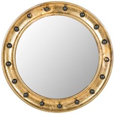 a round mirror with rivets on the edges and black beads around the edge