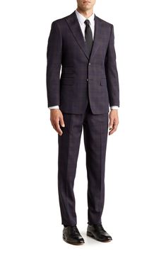 Make a dapper appearance at your next formal event in this clean-cut plaid suit that includes a peak lapel jacket and flat-front trousers. Jacket: 30.5" length (size 40R); trousers: 11" rise, 36" inseam (size 33W) Jacket has four-button cuffs; chest welt pocket; front flap pockets Trousers have zip fly closure; front pockets; back pockets Shell: 79% polyester, 20% rayon, 1% spandex Lining: 100% polyester Dry clean Imported Model stats: 6'1" height, 32" waist. Model is wearing size (size 33W). Plaid Notch Lapel Suit For Formal Occasions, Elegant Plaid Suit With Notch Lapel, Formal Plaid Suits With Notch Lapel, Tailored Plaid Suit With Notch Lapel, Tailored Plaid Suit For Semi-formal Occasions, Semi-formal Plaid Suit With Notch Lapel, Plaid Suits For Semi-formal Occasions, Plaid Semi-formal Suit, Semi-formal Plaid Suit