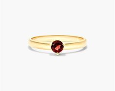 This 14K yellow gold 2.3mm garnet solitaire birthstone ring is a beautiful and unique piece of jewelry. The garnet is a January birthstone and is said to represent love, passion, and protection. This ring is made from high-quality materials and is sure to last for years to come. The ring features a 2.3mm garnet gemstone set in a 14K yellow gold solitaire setting. The ring is available in a variety of sizes to fit any finger. It is also available in a variety of birthstones, so you can find the p Yellow Gold Garnet Solitaire Jewelry, Classic Garnet Birthstone Ring In Yellow Gold, Classic Yellow Gold Garnet Birthstone Ring, Yellow Gold Garnet Birthstone Ring, Classic Ruby Ring With Tension Setting As Gift, Classic Ruby Ring With Tension Setting For Gift, Garnet Birthstone Ring In Yellow Gold, Petite Rings, Petite Ring