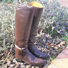 a pair of brown boots sitting on the ground