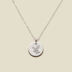 a necklace with a flower on it