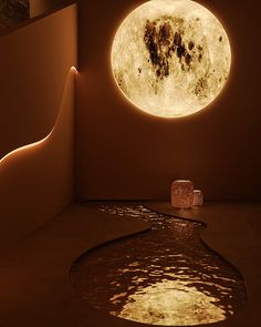 a room with a large moon in the ceiling and some water on the floor next to it