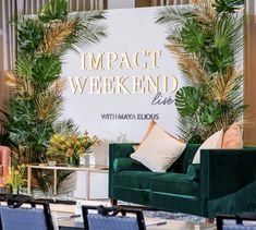 a green couch sitting in front of a white sign that says impact weekend live on it