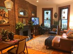 a living room filled with furniture and a fire place