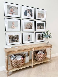 a wooden table topped with pictures and baskets