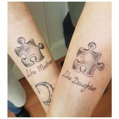 two people with matching tattoos on their arms that say like mother, like daughter and puzzle pieces