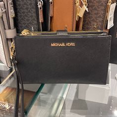 Michael Kors Large Double Zip Wristlet Wallet Phone Case Clutch Black Michael Kors Large Double Zip Wristlet Wallet, Clutch, 100% Genuine Saffiano Leather Gold Tone Hardware 6 Credit Card Holders 1 Id Holder 2 Slip Compartments 2 Zip Pockets A Phone Holder Slot And A Large Bill Section Accessible From The Side 7.25" X 4.25" X 1" Comes With A Detachable Wrist Strap This Is An Outlet Style Mk Wallet, Leather Clutch Wallet, Leather Billfold, Michael Kors Wristlet, Zippered Clutch, Large Wallet, Black Leather Wallet, Michael Kors Wallet, Wristlet Wallet