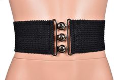 *Free USA shipping on orders $20+ *Handmade after you order: check order processing times Add a defined waistline to your outfit with this stretchy black decorative elastic belt. The elastic has a horizontal wavy pattern with a scalloped edge. The silver buckle has an interlocking circle design similar to a vintage nurse belt. In the photos it was worn over a Black Mesh Mini Skater Dress (sold separately). ♦WIDTH: 3 inches (78mm) ♦FEATURES: silver buckle with retro interlocking circle design ■SI Black Fitted Casual Belt, Black Fabric Belt For Summer, Black Stretch Elegant Corset Belt, Vintage Nurse, Mini Skater Dress, Scalloped Edge, Black Mesh, Circle Design, Waist Belt