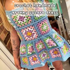 a woman wearing a crochet handmade granny square dress with flowers on it