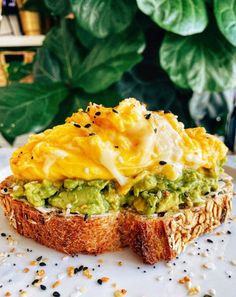 an open face sandwich with guacamole and sour cream on toasted bread