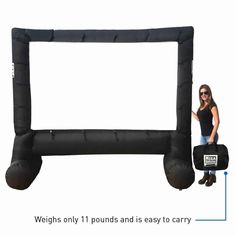 a woman standing next to an inflatable rectangular frame with the words weight only 11 pounds and is easy to carry