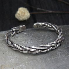 Men's Sterling Silver Thick String Braided Cuff BraceletHill tribe silver cuff bracelet.Handmade in Northern Thailand.Solid and heavy, engraved with traditional patterns. Product DetailsMetal Type: 925 Sterling SilverColor: SilverGender: MaleAge Group: AdultWidth: 7.7 mmInner Diameter: 58 mmWeight: 45 gPaymentFor the safety of your funds, we only accept PayPal payments.You can pay with a credit card through PayPal, even if you don't have a PayPal account.Please see our Payment page for details.ShippingUSA - USPS, 5-7 business days, $5Worldwide - EMS, 10-20 business days, $5FREE SHIPPING on orders over $49.Please see our Shipping page for details. Return30 Days Money Back Guarantee. Please see our Warranty and Return page for details.Have Any Questions?Please feel free to CONTACT US. We wil Traditional Engraved Sterling Silver Braided Bracelets, Traditional Sterling Silver Braided Bracelet, Traditional Engraved Sterling Silver Braided Bracelet, Traditional Silver Braided Bangle Bracelet, Mens Ring Designs, Silver Jewelry Diy, Mens Silver Jewelry, Blue Topaz Engagement Ring, Mens Bracelet Silver