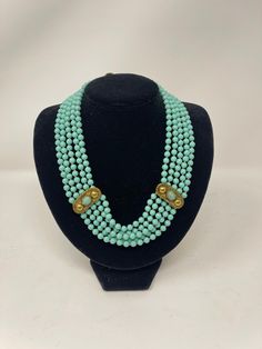 "Luisa Conti Multi Strand Turquoise and Gold Glass Beaded Choker Necklace/ Chunky Necklace/Bold Necklace/ 18\" Length/ Stunning Look closely at the photos and video for the best description. Necklace is in Very good condition. All of my Jewelry pieces come with Free Shipping to the United States and are shipped priority mail for quick delivery to your home. For your consideration here is the link to other Jewelry Gifts Listings https://www.etsy.com/shop/ArteDeBijouxByEleni?ref=simple-shop-header Elegant Turquoise Beaded Emerald Necklace, Turquoise Round Beads Emerald Necklace, Elegant Multi-strand Turquoise Gemstone Necklace, Elegant Turquoise Necklace With Large Beads, Elegant Turquoise Beaded Necklace Hand-strung, Elegant Hand-strung Turquoise Beaded Necklaces, Formal Turquoise Handmade Necklace, Formal Handmade Turquoise Necklace, Bold Necklace