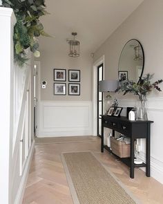 the hallway is clean and ready for us to use as an entrance way in this home