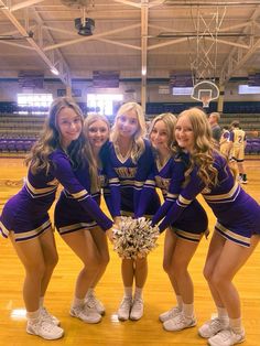 the cheerleaders are posing for a photo together