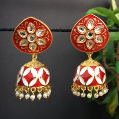 Fancy Party Wear Traditional Earrings. Perfect with ethnic & traditional wear. Perfect gift for any occasion for yourself and your dear ones. It is advisable to store jewellery in a zip lock pouch (air tight pouch), keep away from water perfume and other chemicals and clean it with dry and soft cloth. Red Cutdana Earrings For Navratri, Traditional Red Jhumkas With Cutdana, Red Cutdana Jhumkas For Wedding, Red Cutdana Jhumkas For Diwali, Festive Red Cutdana Jhumkas, Traditional Red Earrings With Zari Work, Festive Red Jhumkas With Zari Work, Bollywood Bridal Earrings With Meenakari For Festivals, Bollywood Meenakari Bridal Earrings For Festivals