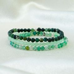 Green Beaded Bracelet Set, Crystal Healing Beaded Bracelets for Women, Spiritual Protection Gift, Stretch Stacking Bracelet, Gift for Her ❗Adult bracelet length recommended to choose from 6.5'' This triple-layered bracelet set features natural green stone beads in varying shades, showcasing the beauty and harmony of nature while offering profound healing properties and spiritual protection. Each bracelet is crafted with high-quality natural green gemstones, designed to bring balance and protecti Adjustable Green Crystal Bracelet With 108 Beads, Elegant Green Round Beads Friendship Bracelets, Green Stackable Beaded Bracelets With Round Beads, Stackable Green Beaded Spiritual Bracelets, Green Stackable Spiritual Beaded Bracelets, Spiritual Green Stackable Beaded Bracelets, Women Spiritual, Aura Protection, Green Beaded Bracelets