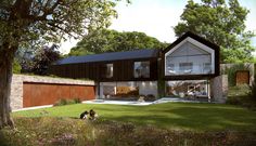 an artist's rendering of a modern house in the woods with two dogs on the lawn