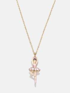 a gold necklace with a pink ballerina on the front and a chain attached to it