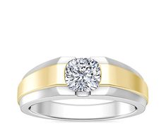 a white and yellow gold ring with a diamond