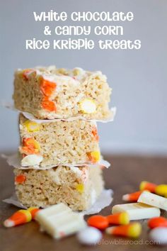 white chocolate and candy corn rice krispie treats are stacked on top of each other