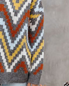 Oversize Fit 68% Acrylic. 29% Nyon and 3% Spandex Hand Wash Cold. Dry Flat Wide Neckline Long Sleeves Thick Fabrication No Closures Not Lined Surround yourself in cozy in our We Vibe Knit Chevron Sweater! This oversized sweater features charcoal. yellow. light blue. cream. and rust hues in a chevron print. Finished with a crew neckline. Styled with the Perfect Hoop Earrings. Chloe Mini Necklace. Compass Coin Necklace. Simple Bangle Bracelet. Stella Crossbody Envelope Zip Clutch. Kason Distressed Knit Chevron, Chevron Sweater, Simple Bangle, Mini Necklace, Surround Yourself, Yellow Light, Chevron Print, Sweater Sale, High Rise Denim