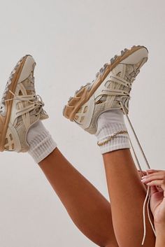 Shop our Gel Sonoma 15-50 Future Trail Sneakers at FreePeople.com. Boho clothing for the creative spirit- free worldwide shipping. Asics Gel Sonoma 15-50 Outfit, Gel Sonoma, Trail Sneakers, Comfy Sneakers, Beige Sneakers, Asics Sneakers, Running Trainers, Shoe Inspo, Low Boots